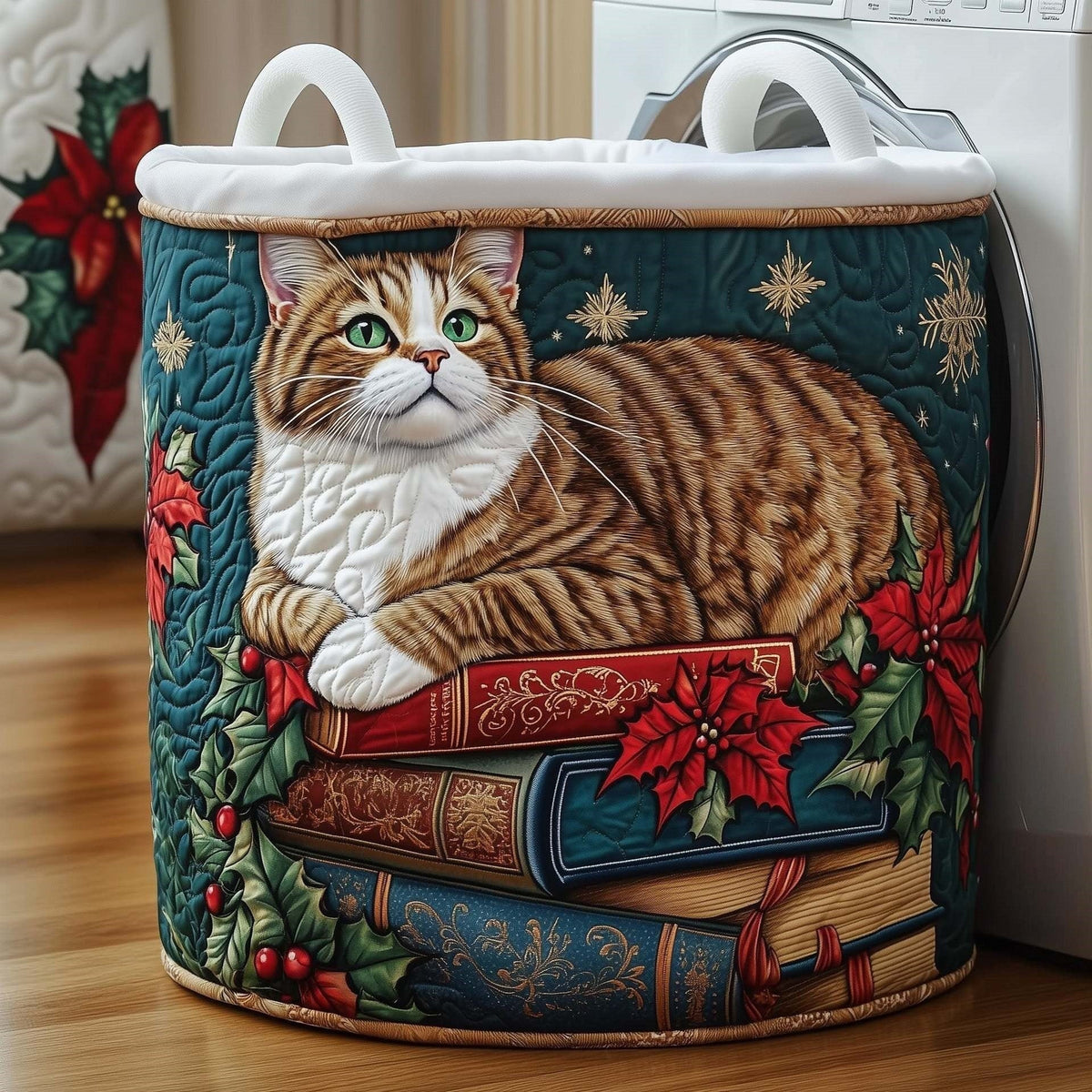 Giuditta hand-quilted laundry basket with a tabby cat resting on vintage books with poinsettias and holly, front view