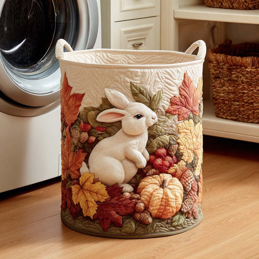 Alba hand-quilted laundry basket with a white bunny among autumn leaves, front view