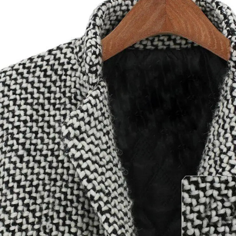 Venetia long wool coat in black and white, close-up of woven texture and lapel