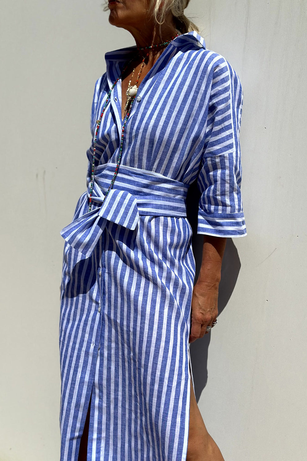 Sally striped midi shirt dress in blue stripes, belted three-quarter view