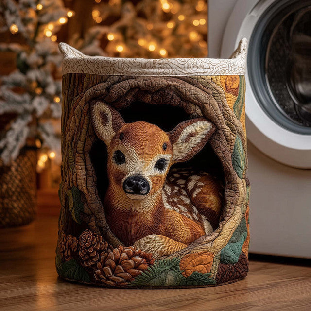 Carmela hand-quilted laundry basket with a fawn resting in a hollow log, front view