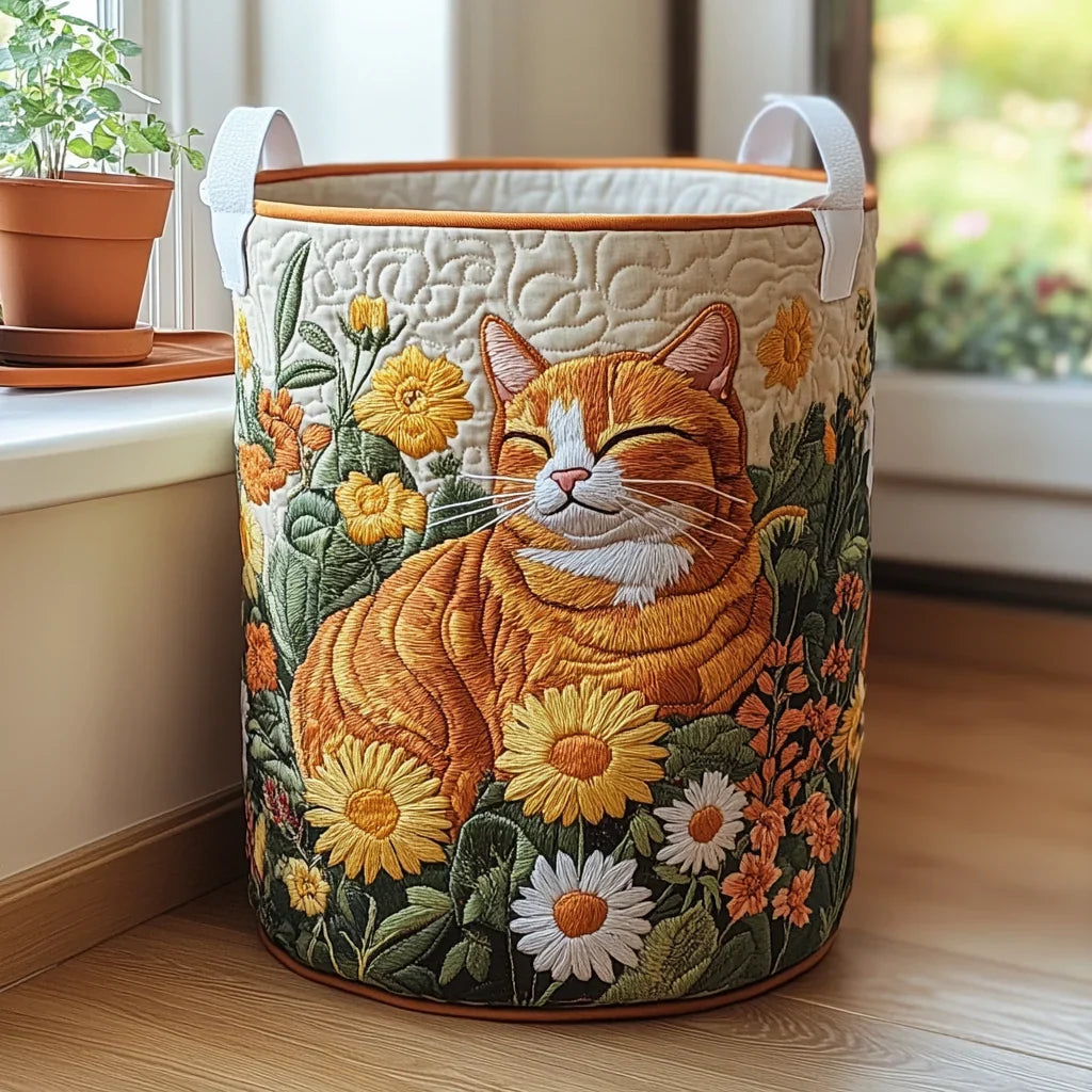 Concetta hand-quilted laundry basket with a ginger cat napping among daisies, front view