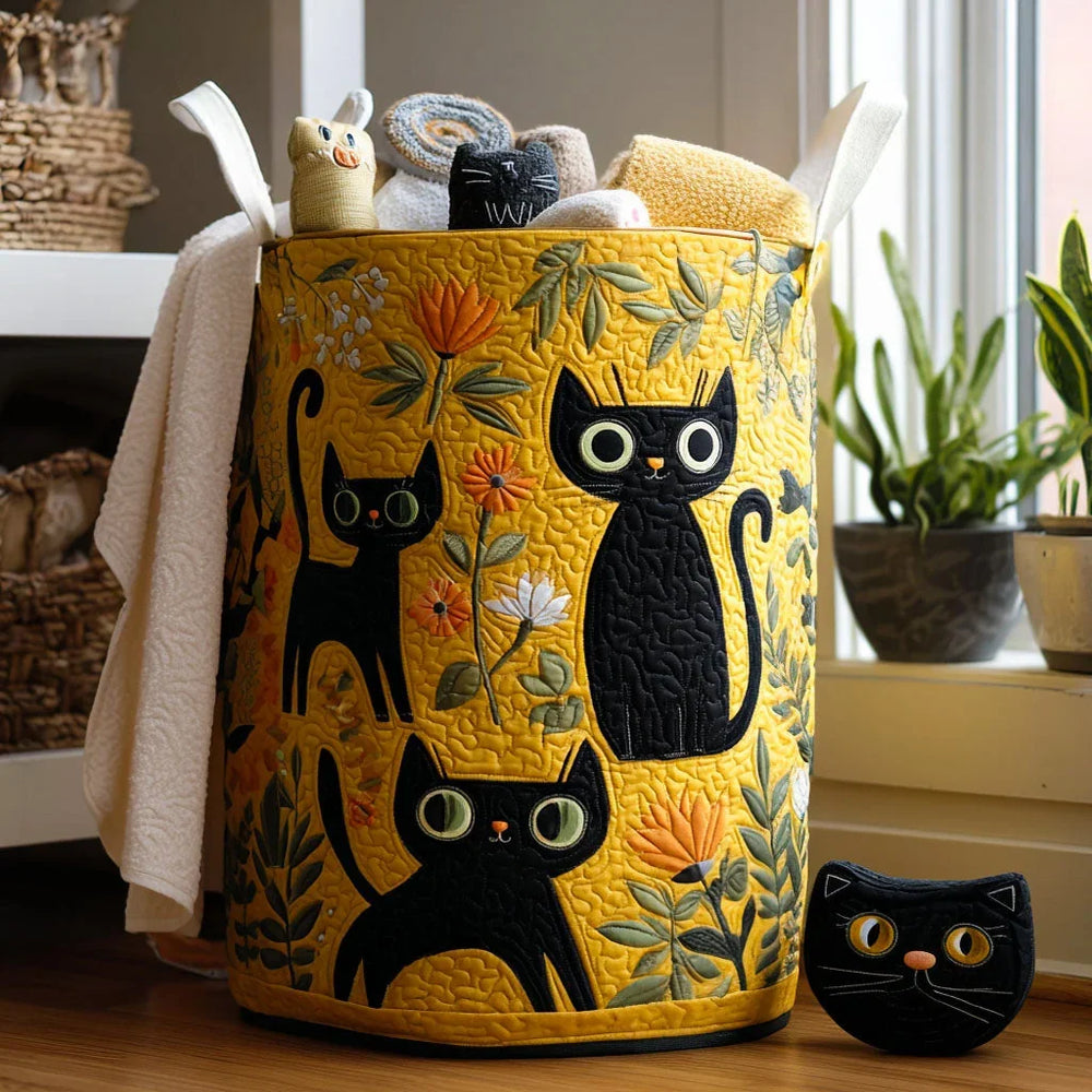 Fiamma hand-quilted laundry basket with black cats among flowers on golden yellow, front view