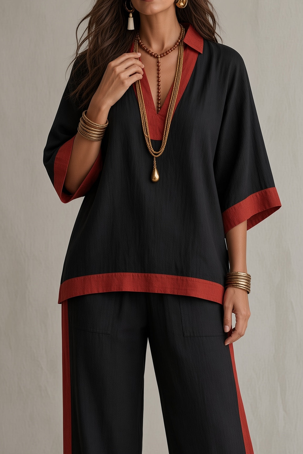 Camellia contrast trim kaftan top and trouser set in black, close-up of red trim