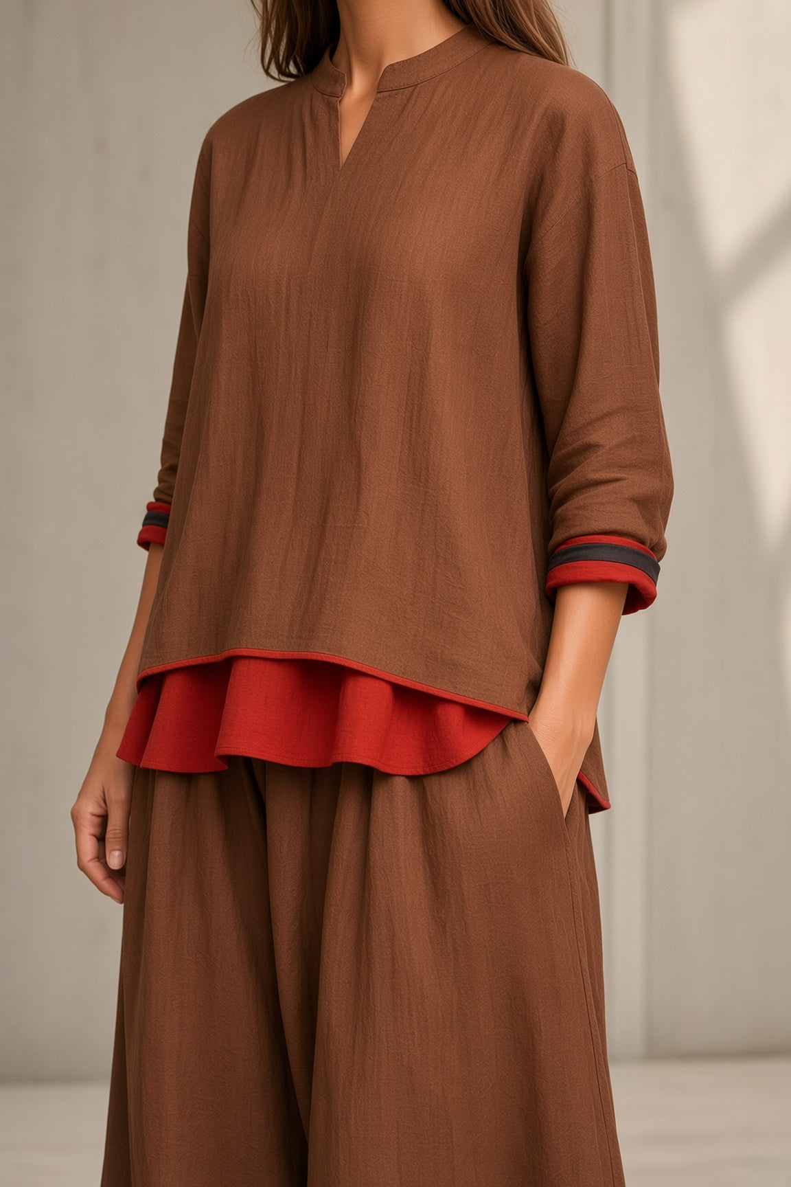 Gertrude layered top and wide-leg trouser set in brown, close-up of top