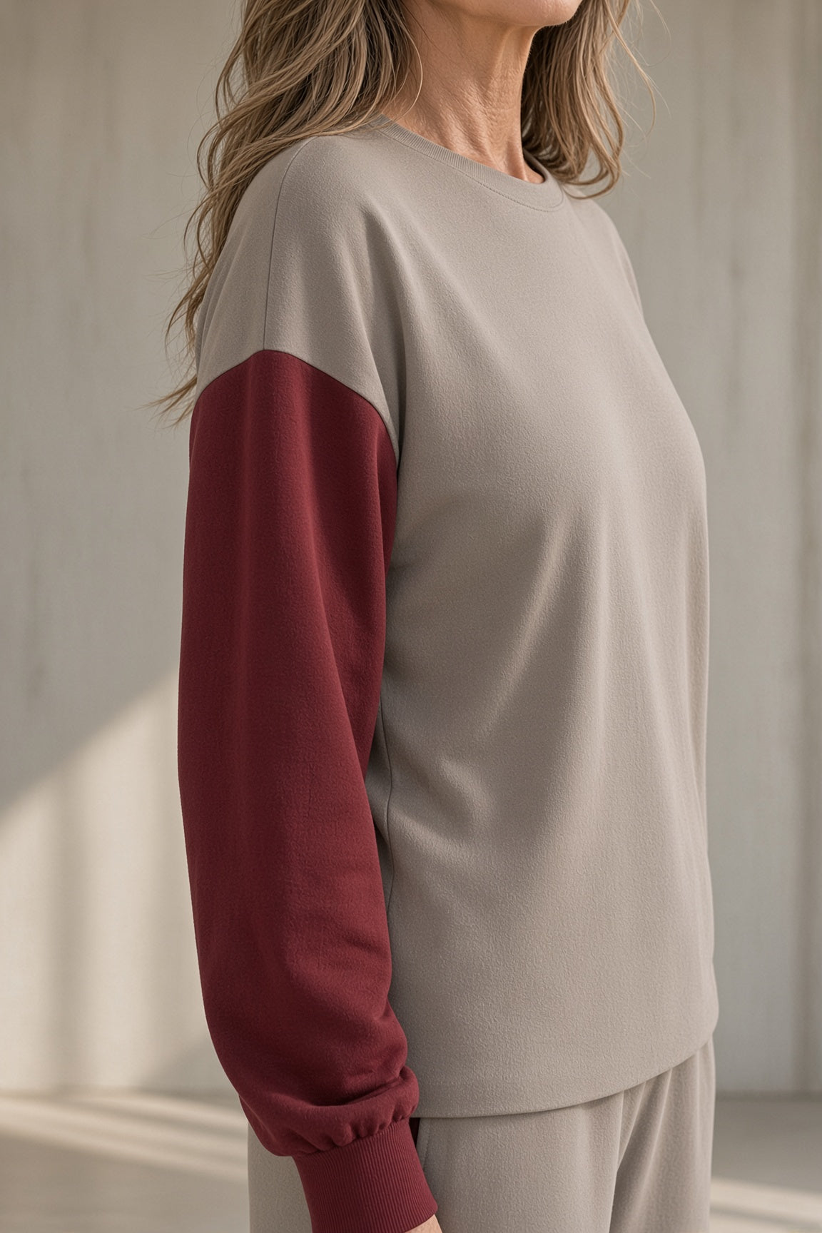 Taylor colour-block sweatshirt and trouser set in grey with burgundy, close-up of sleeve