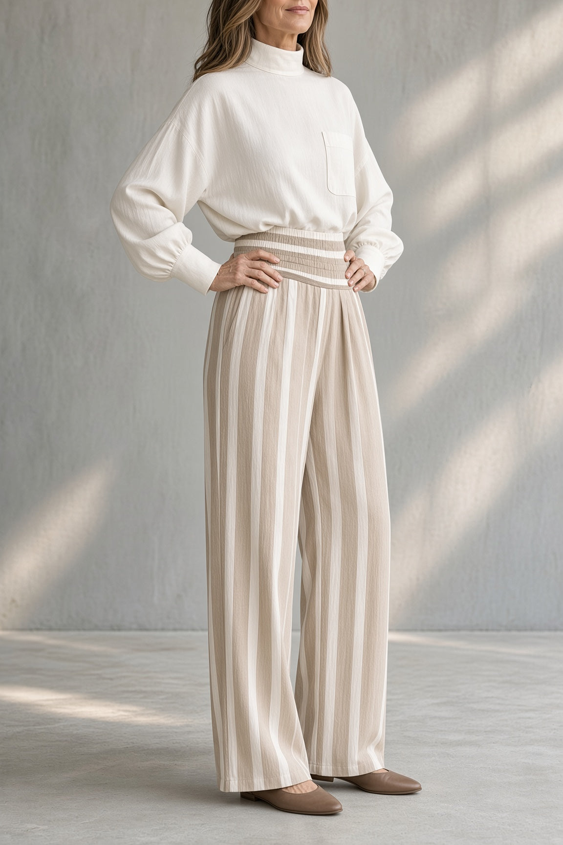 Rosaleen high-neck top and striped trouser set in white, full-length pose