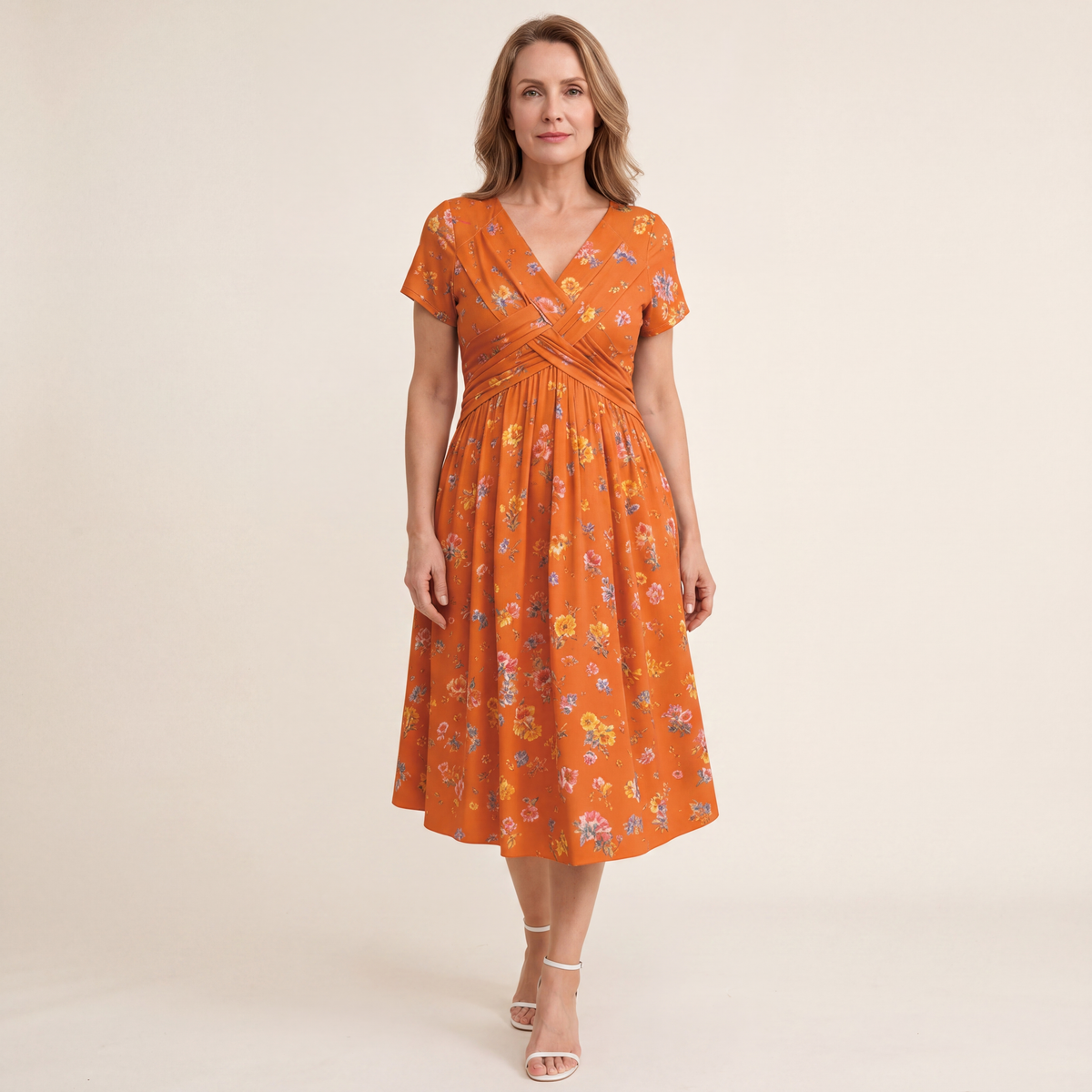 Theresa floral twist-waist dress in orange, full-length front view