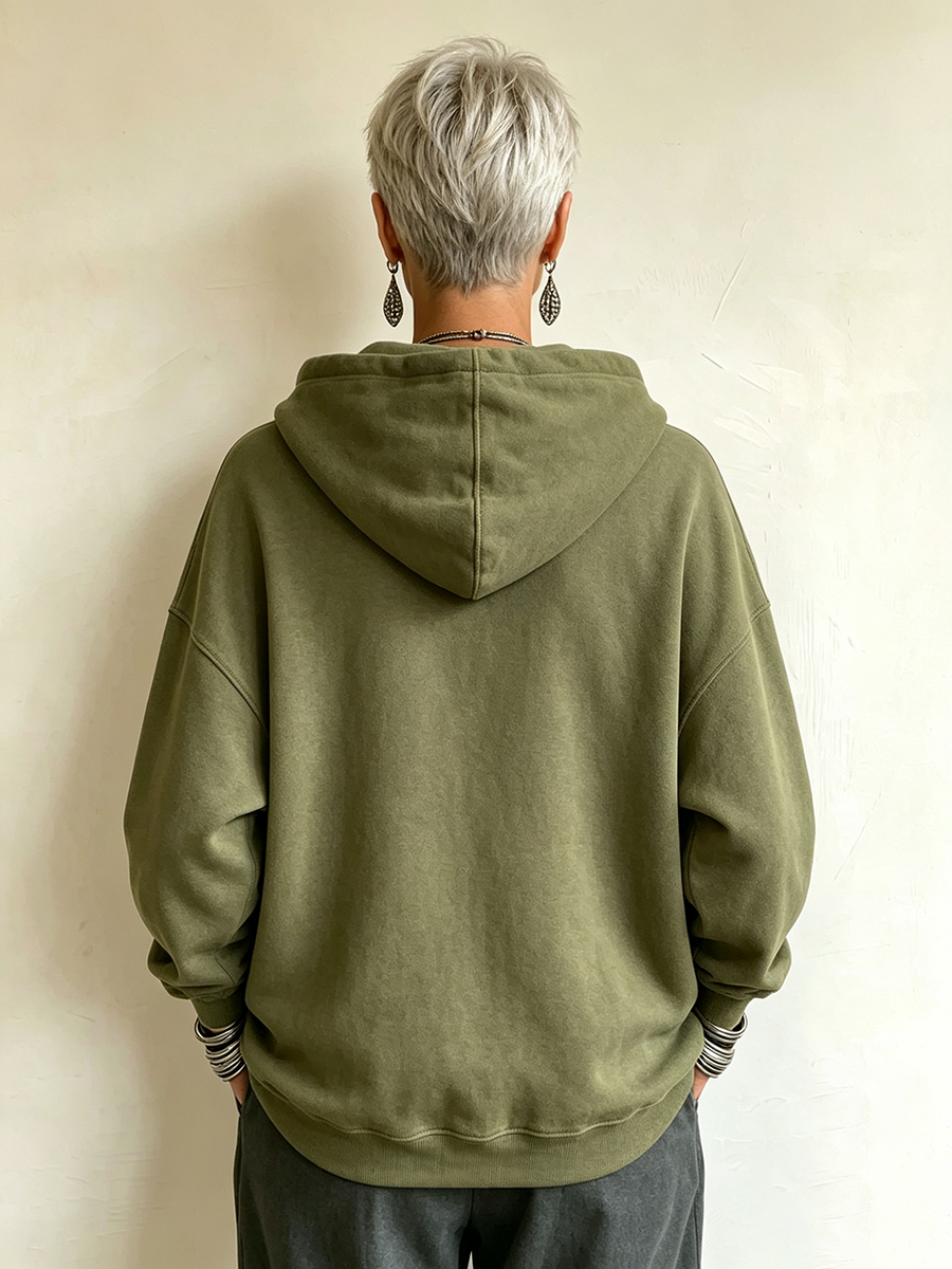 Shona military frogging hoodie in olive green, back view with hood