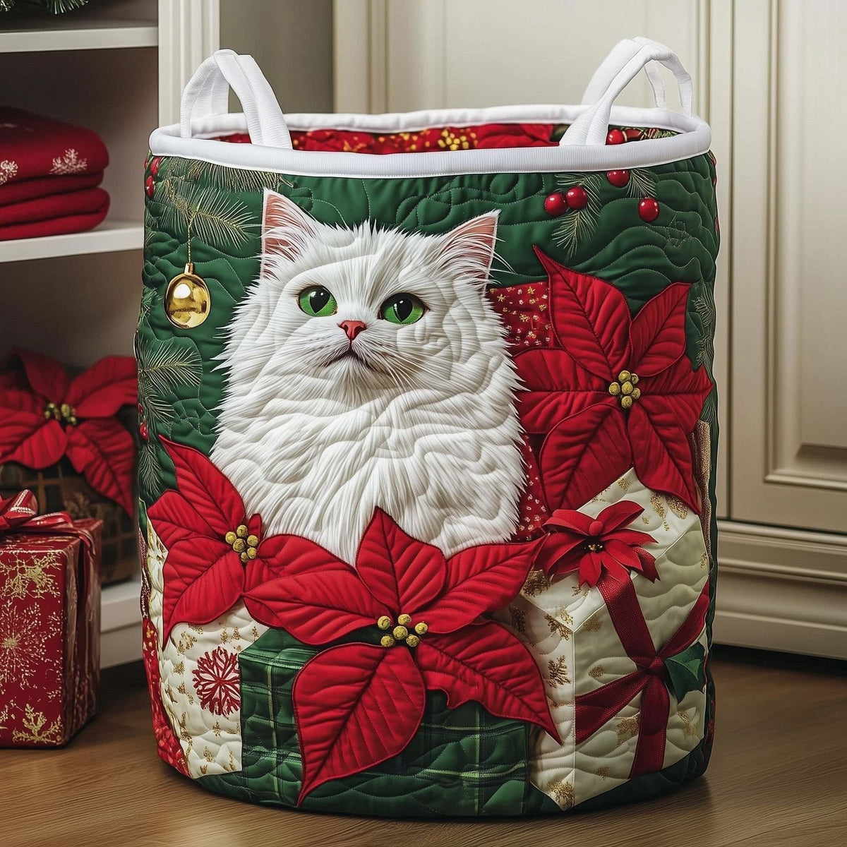 Gisella hand-quilted laundry basket with a fluffy white cat among red poinsettias and wrapped gifts, front view