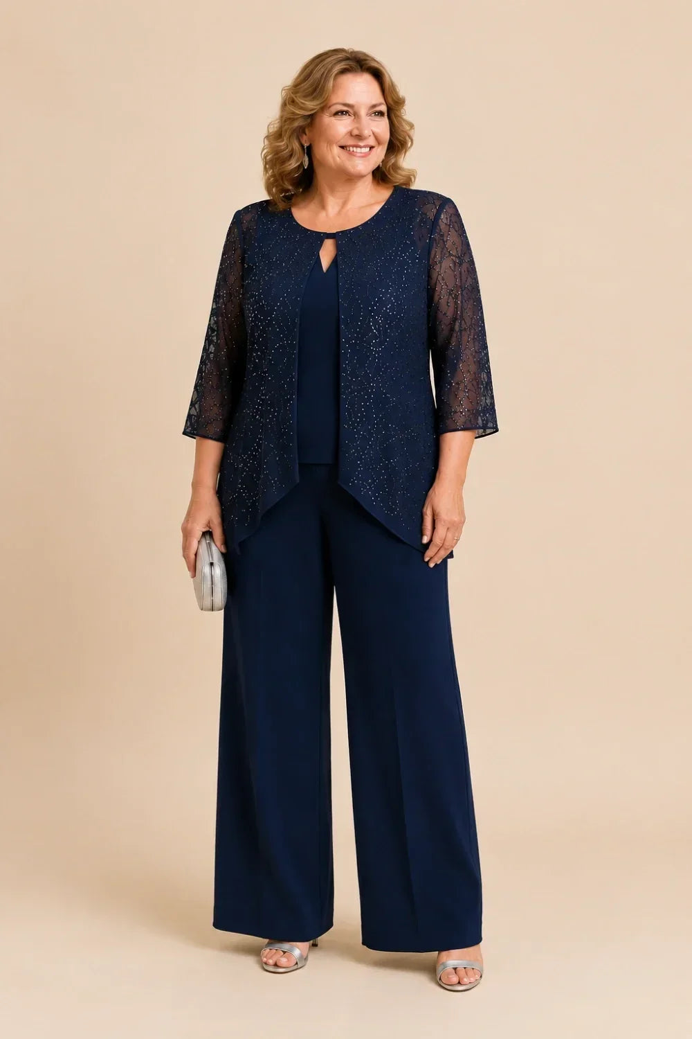 Meredith layered lace trouser suit in navy, full-length front view on second model