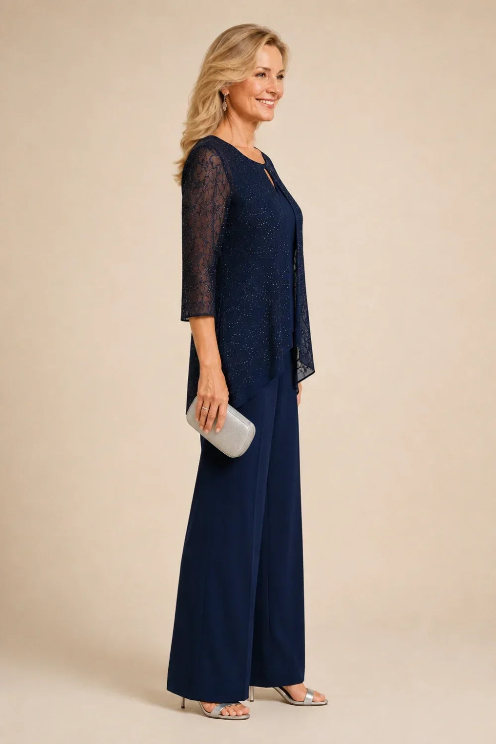 Meredith layered lace trouser suit in navy, side view showing asymmetric hem