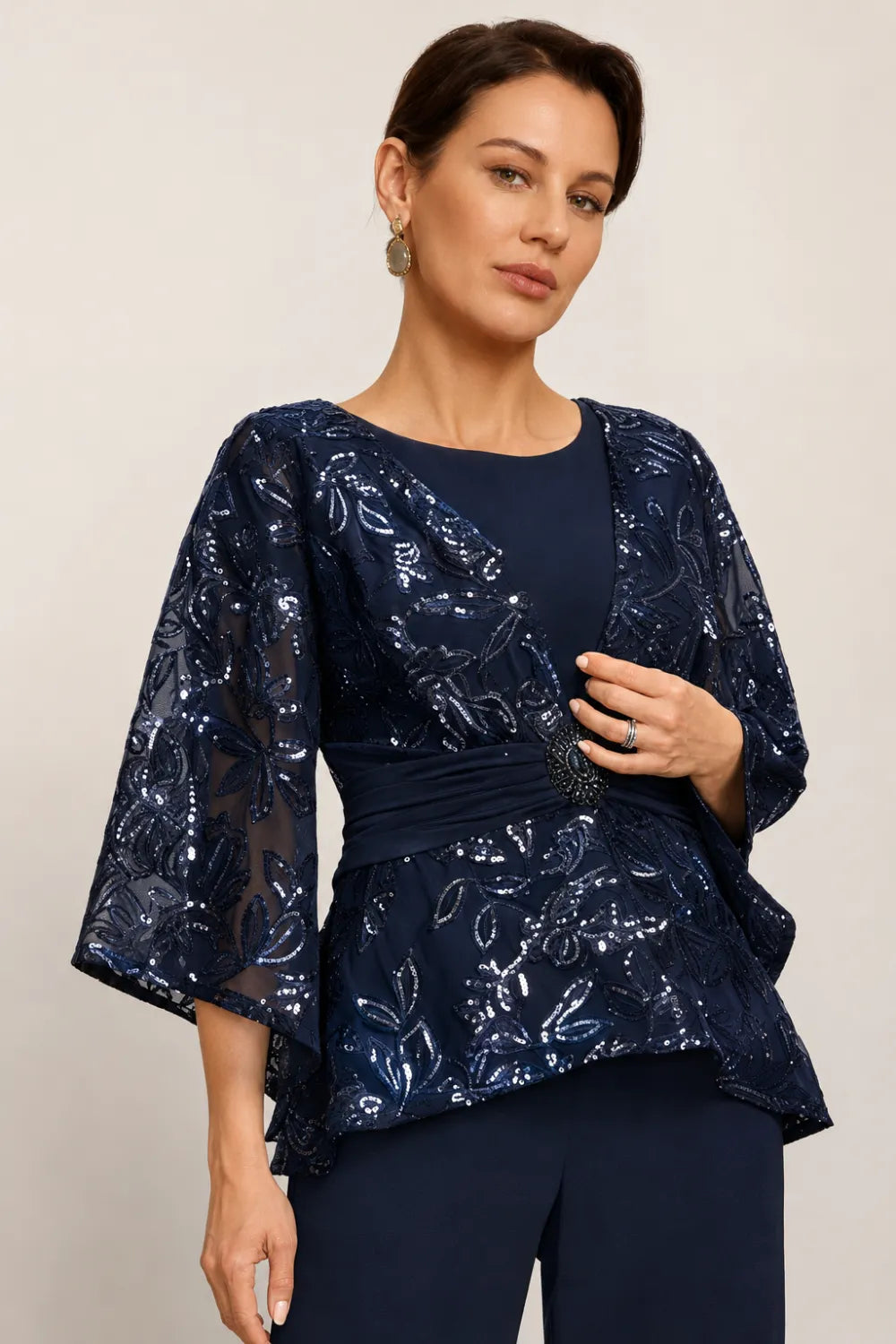 Susannah sequin bell-sleeve trouser suit in navy, close-up of jewelled waist and embroidery