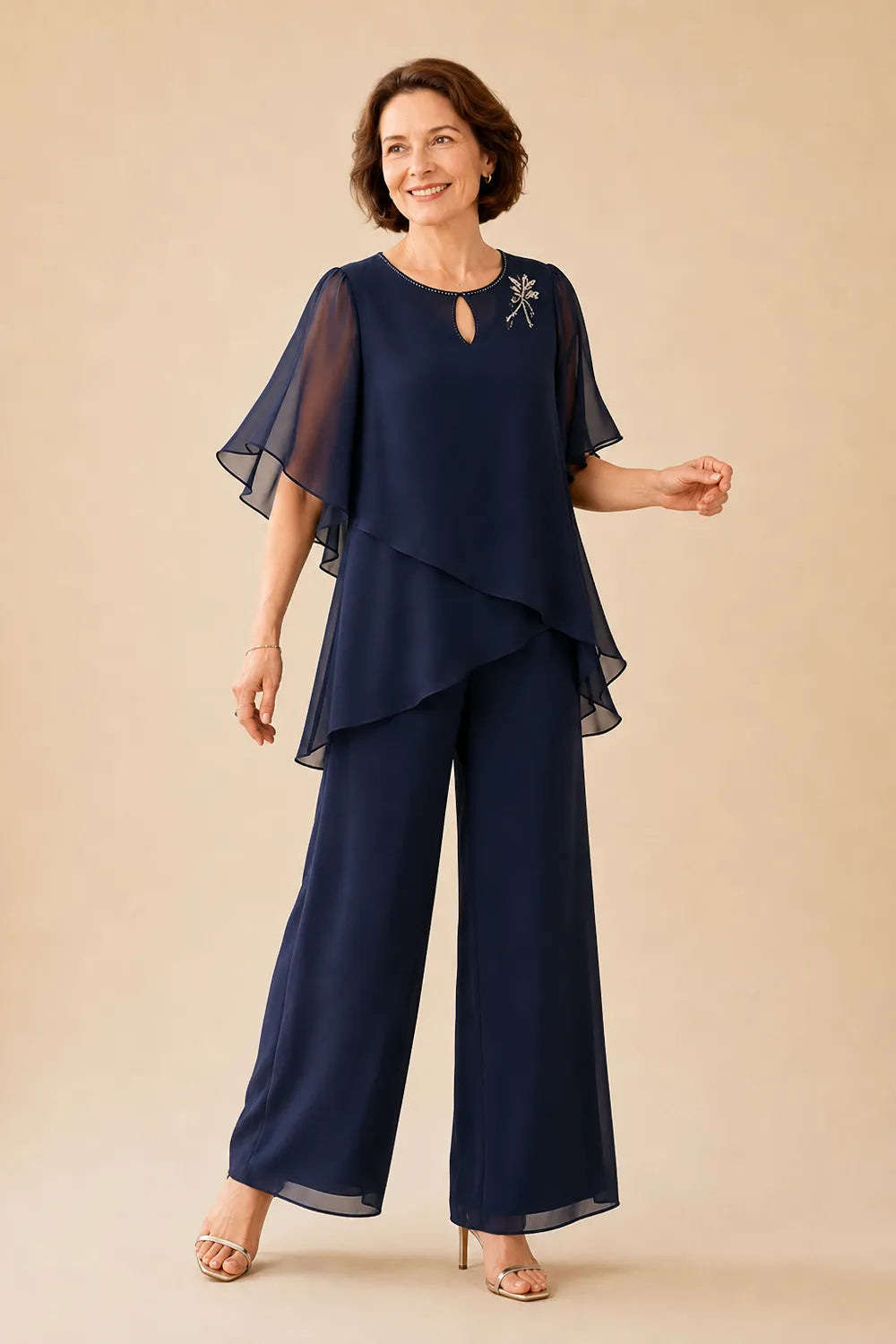 Annabel chiffon cape trouser suit in navy, three-quarter view with flutter sleeves