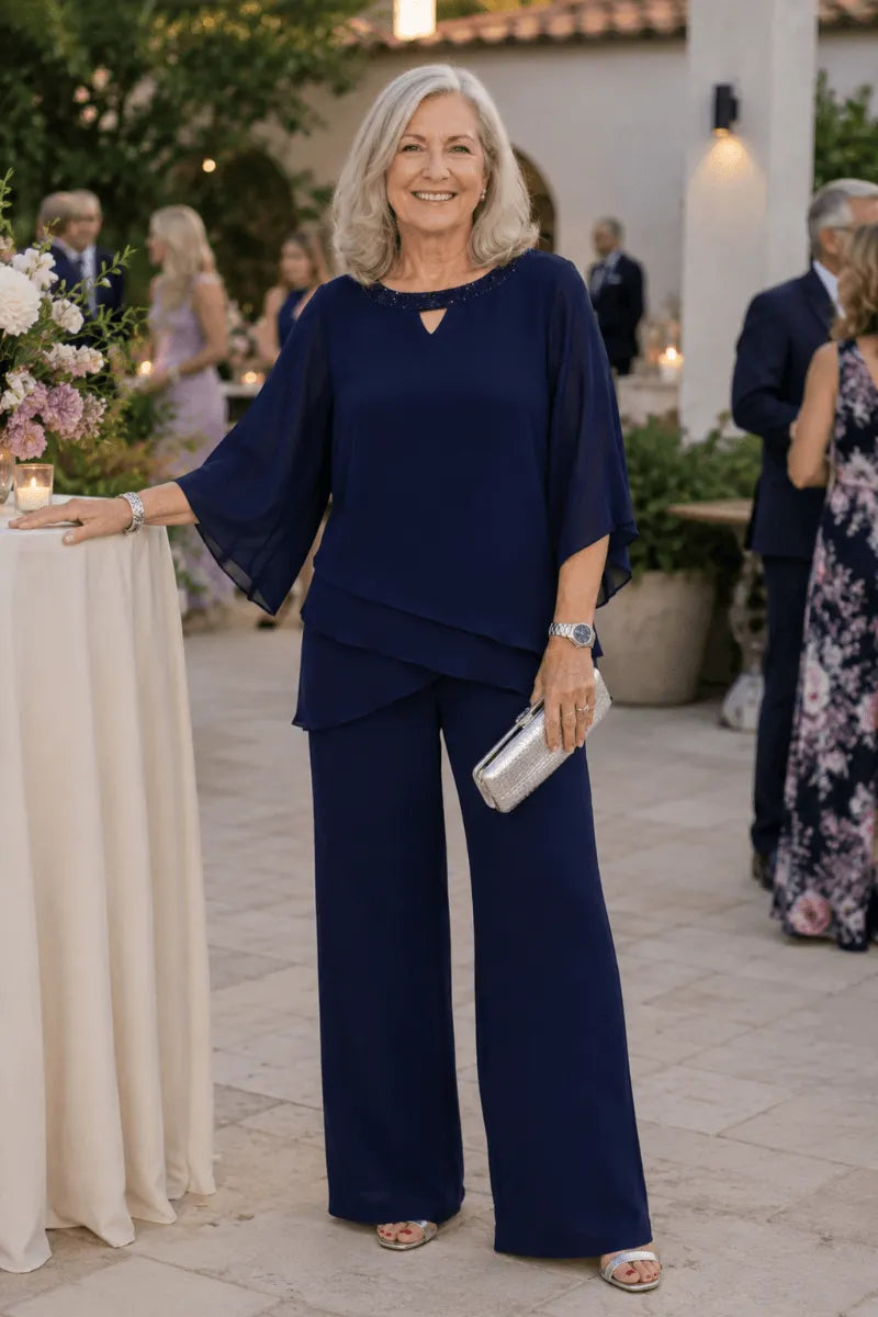 Rosemary layered chiffon trouser suit in navy, worn at an evening garden reception