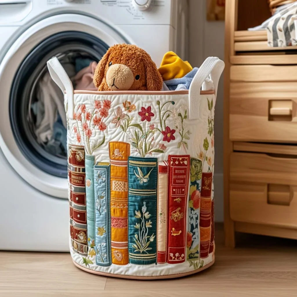 Filomena hand-quilted laundry basket with colourful book spines and blossoms on cream, front view