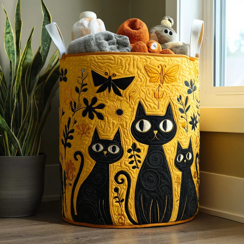Clementina hand-quilted laundry basket with three black cats on mustard yellow, front view