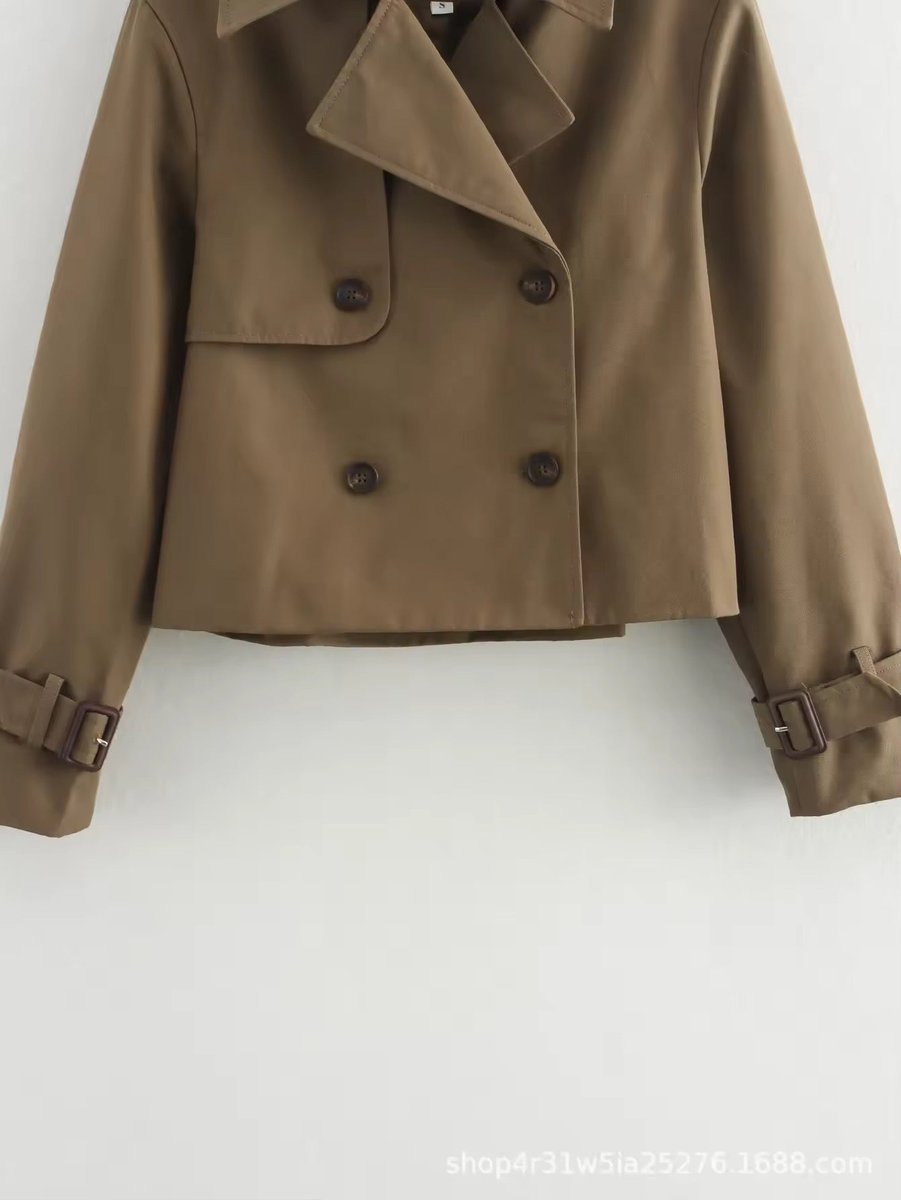 Eugenie short double-breasted trench jacket in brown, close-up of buttons and storm flap