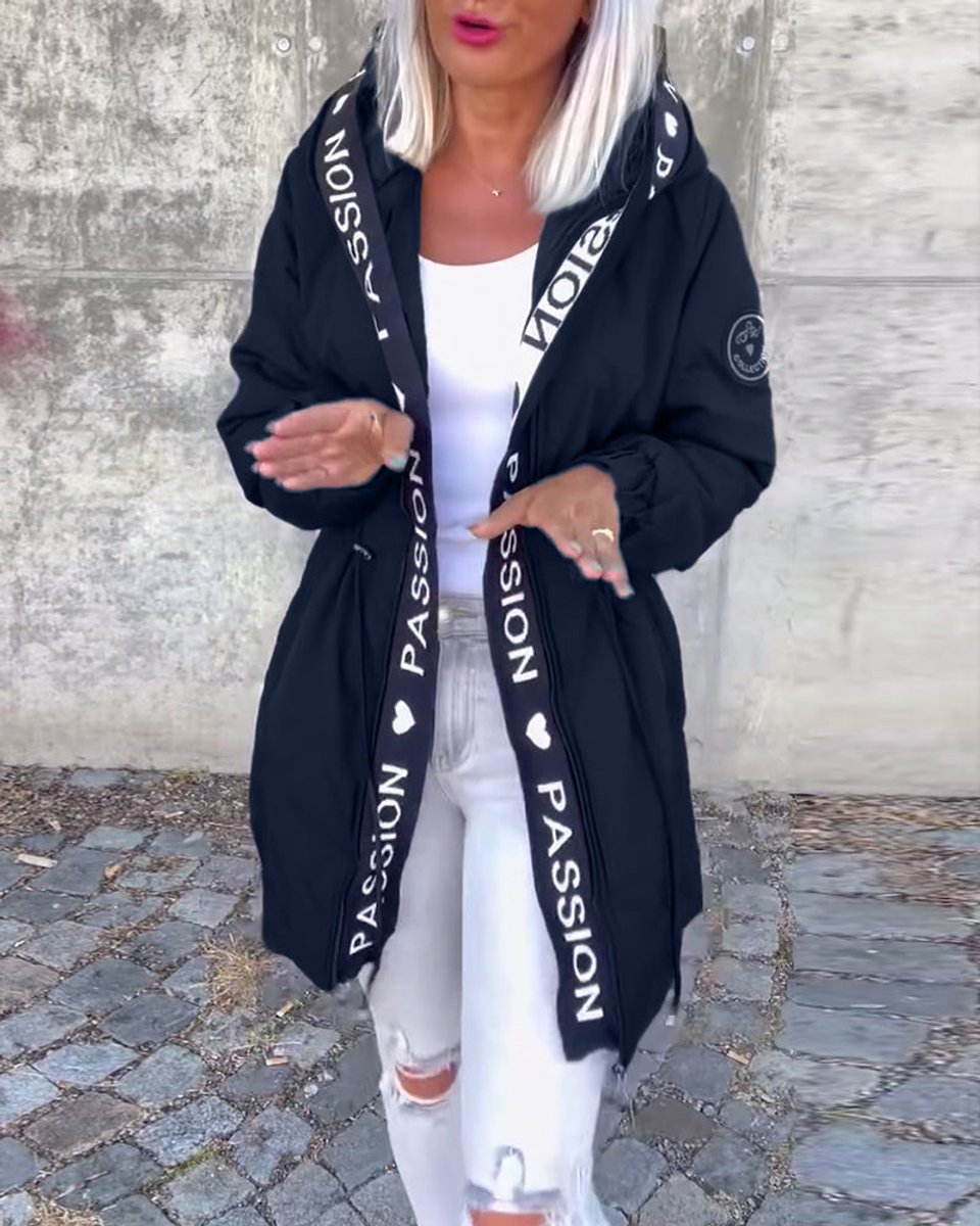 Kitty hooded midi parka in navy blue, worn open with lettered trim