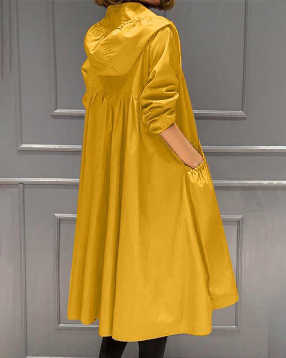 Kathleen long hooded trench coat in yellow, side-back view showing hood and gathered yoke