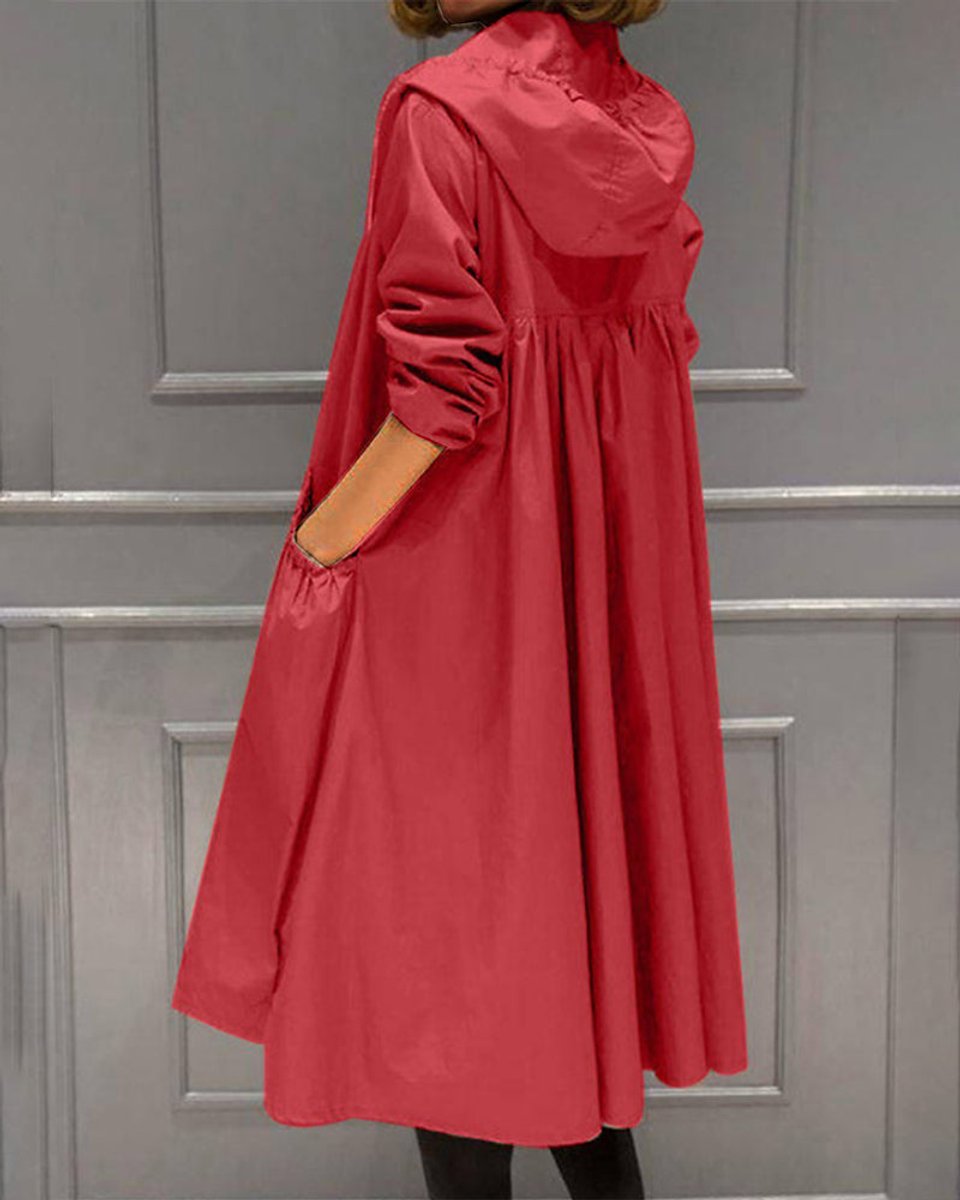 Kathleen long hooded trench coat in red, side-back view with swinging A-line shape