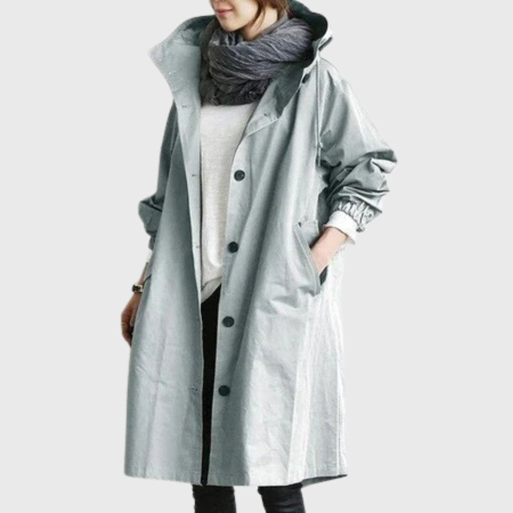 Ruth hooded longline trench coat in light blue, front view with hand in pocket