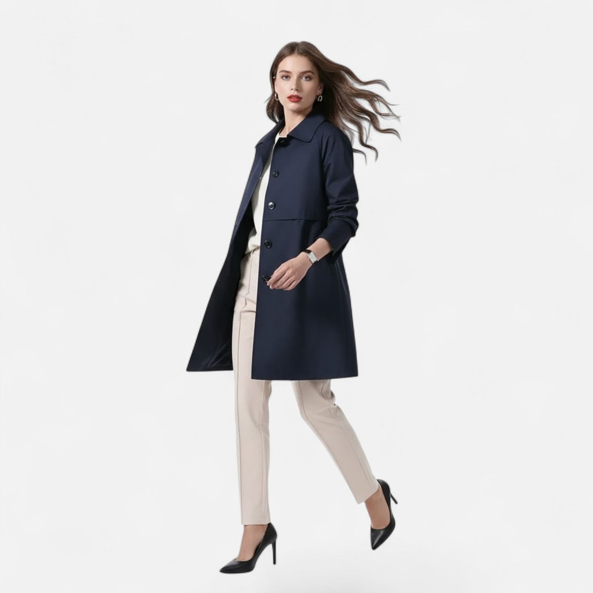 Margery tailored mid-length coat in navy blue, walking view over cream trousers