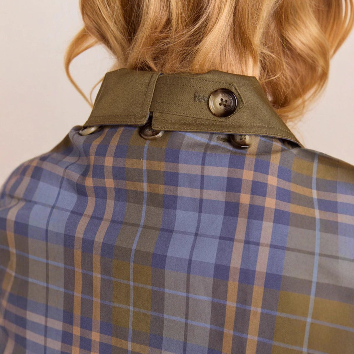 Lorna oversized utility jacket in olive green, close-up of collar buttoned to check scarf