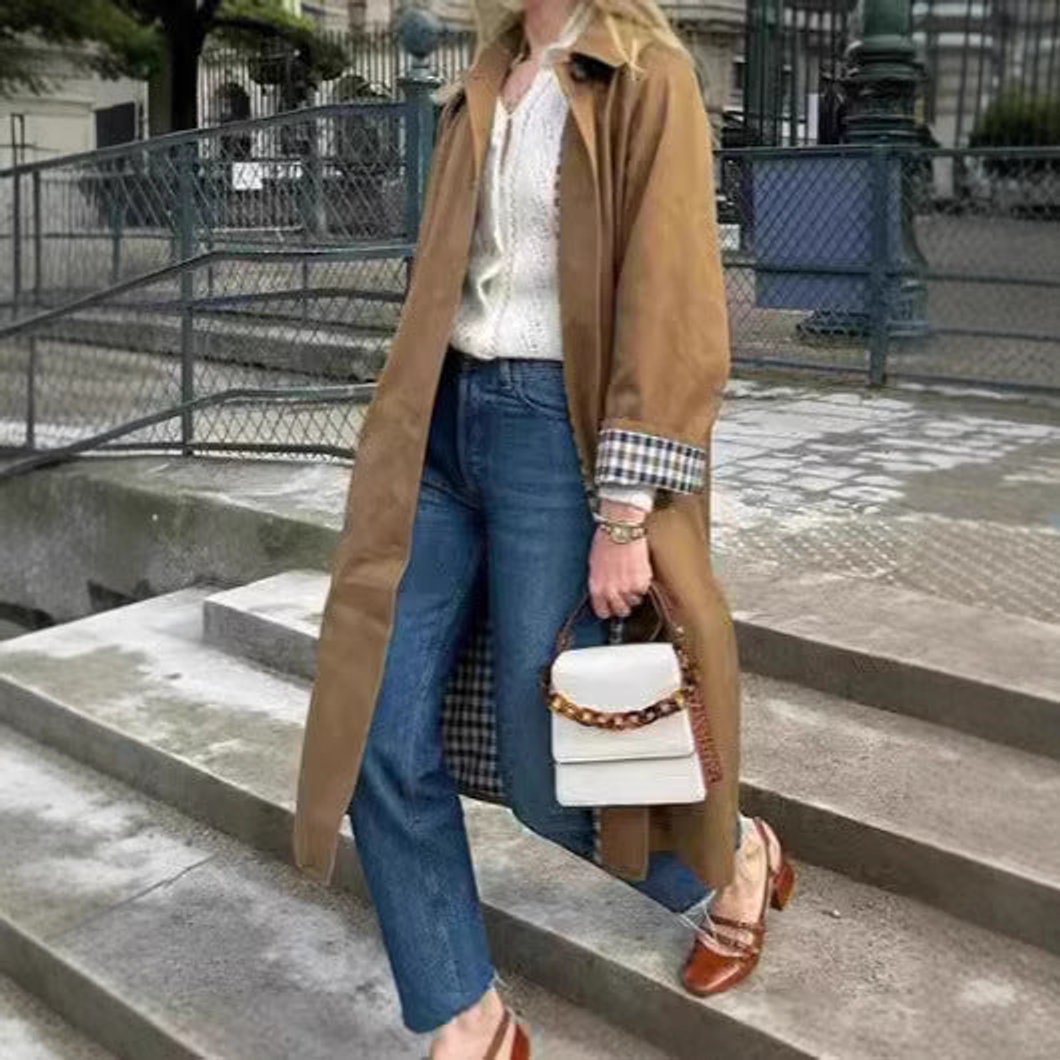 Pippa long oversized trench coat in khaki, full-length view on city steps