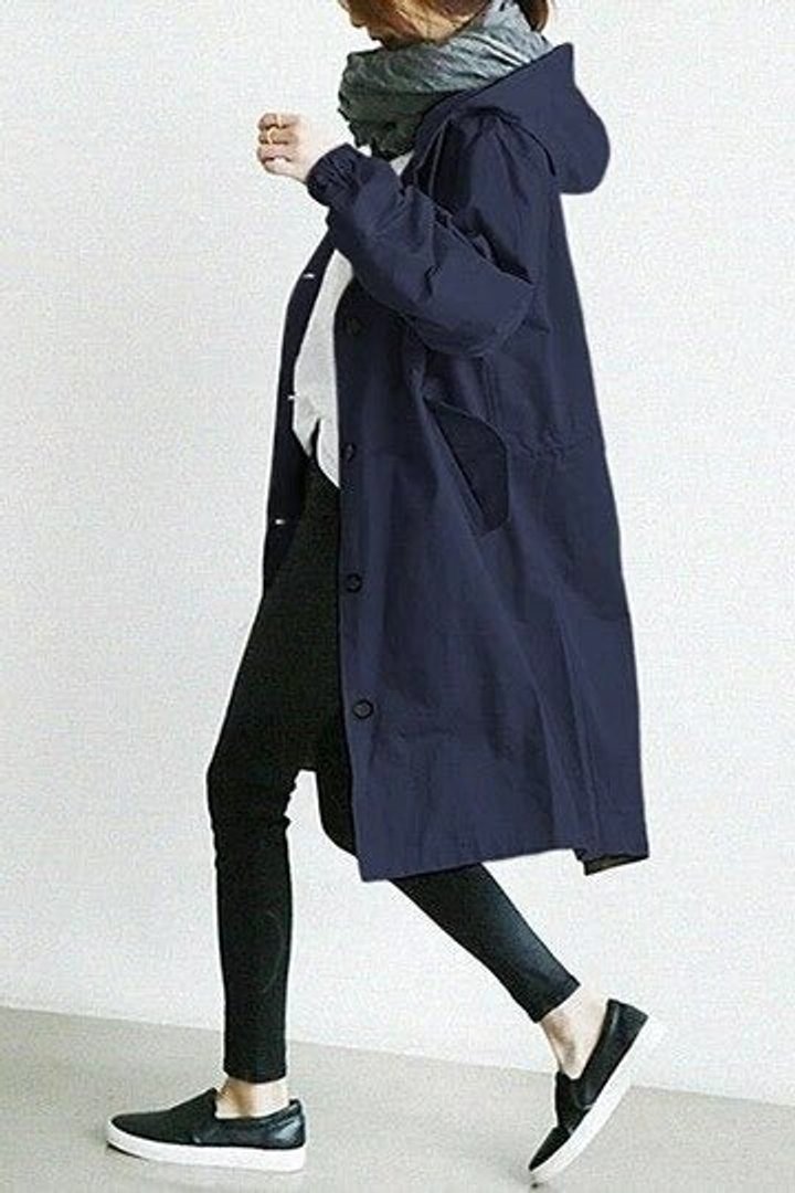 Maisie oversized hooded coat in navy, side view while walking