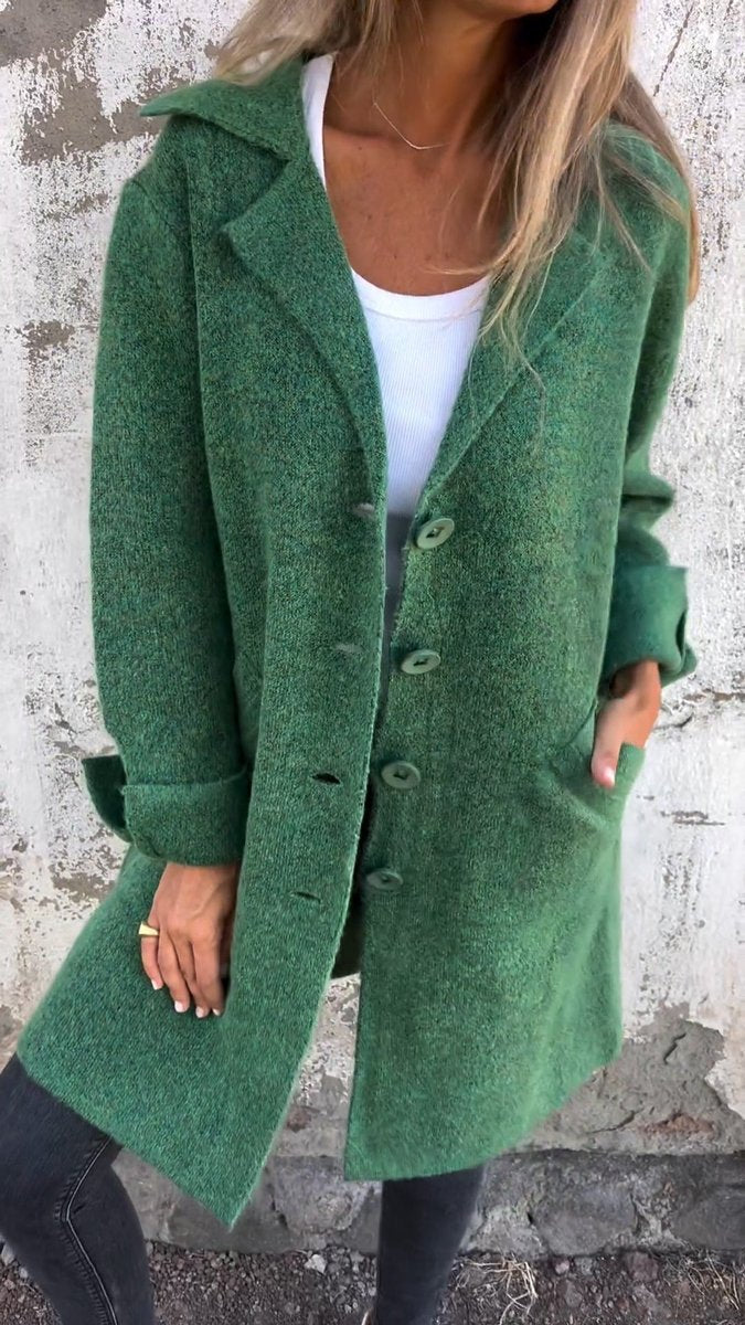 Lucille long lapel coat in green, front view with hand in patch pocket